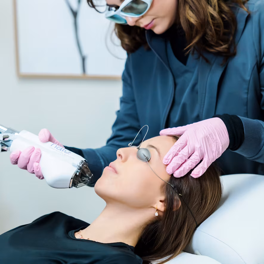 A woman undergoing Halo™ Fractional Laser treatment